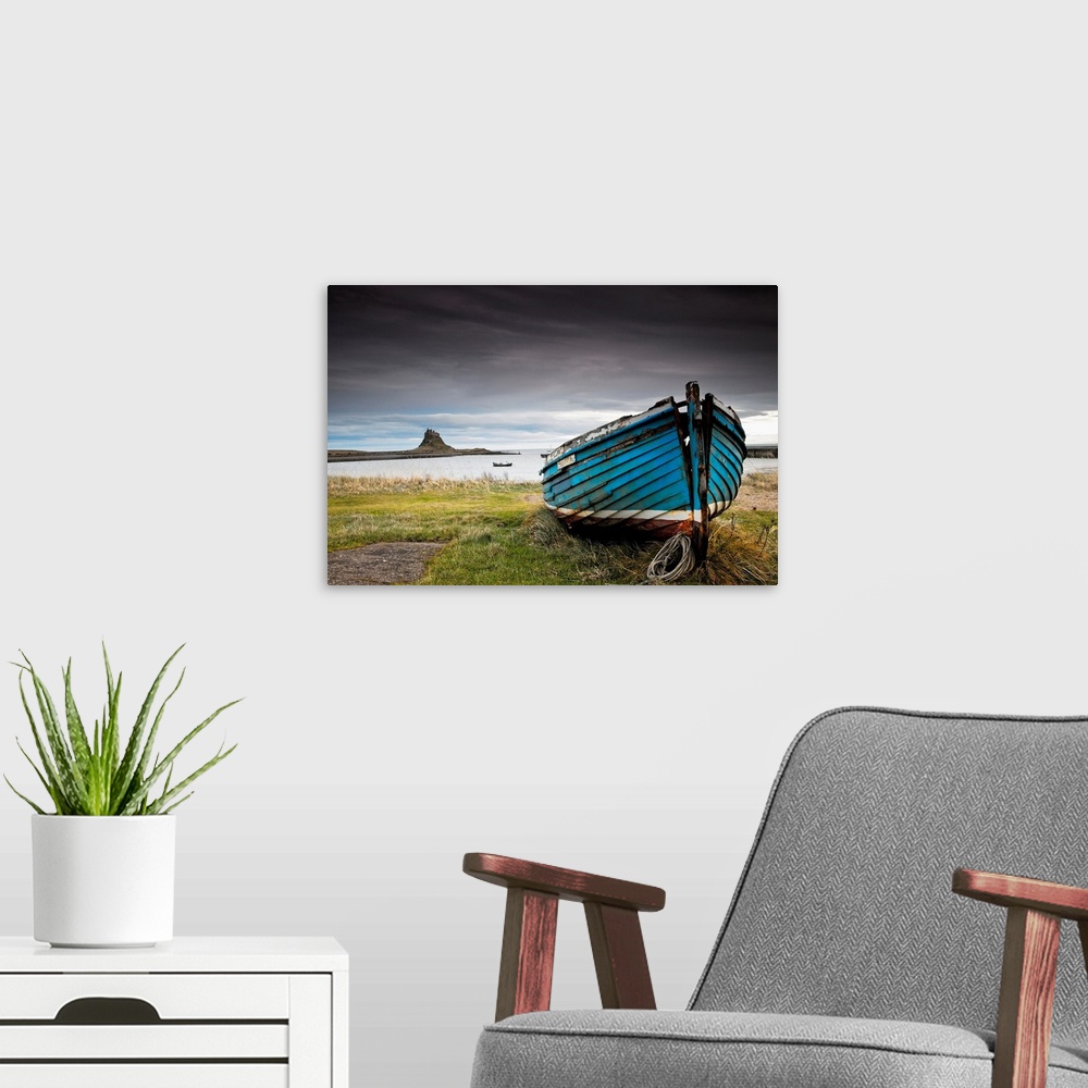 A modern room featuring A Weathered Boat Sitting On The Shore, Northumberland, England