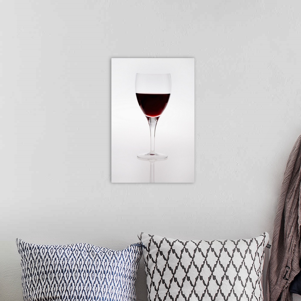 A bohemian room featuring A Wine Glass With Red Wine