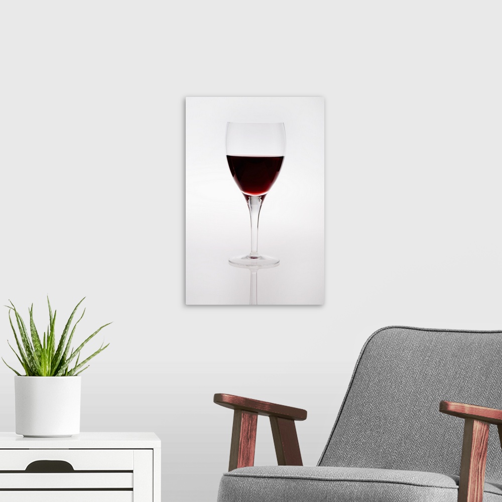 A modern room featuring A Wine Glass With Red Wine