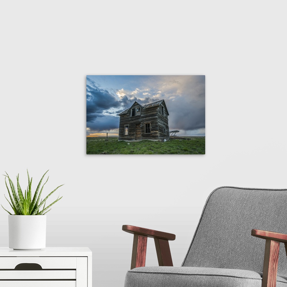 A modern room featuring Abandoned house on the prairies with storm clouds overhead at sunset; Val Marie, Saskatchewan, Ca...