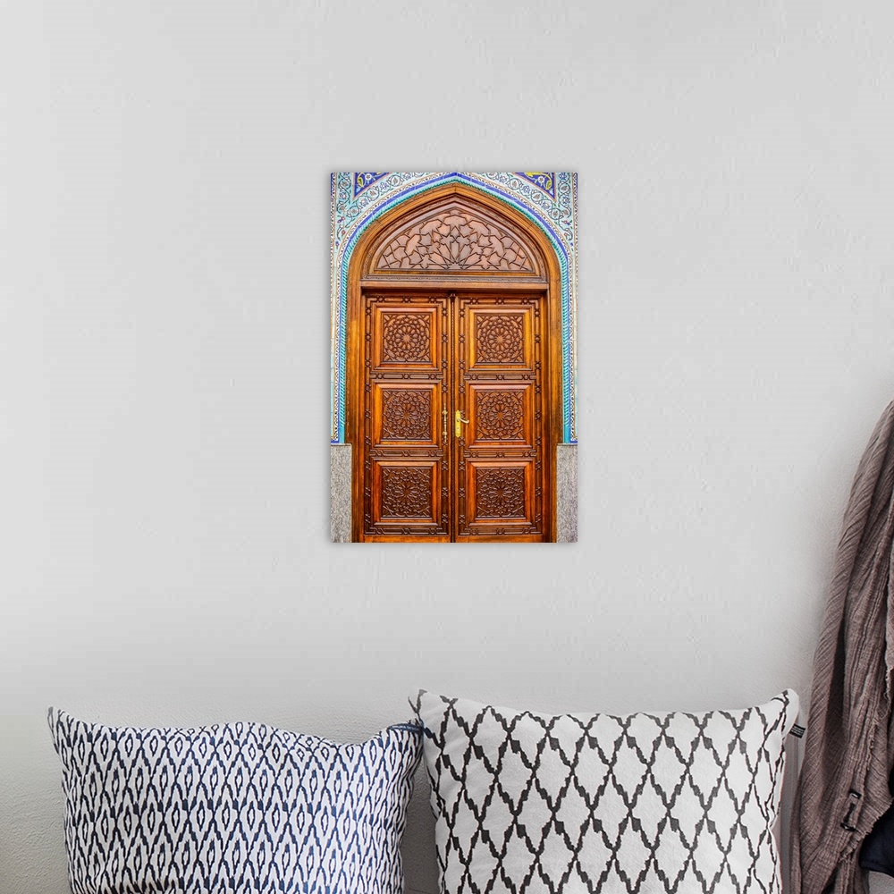 A bohemian room featuring Ali Bin Abi Taleb mosque door.