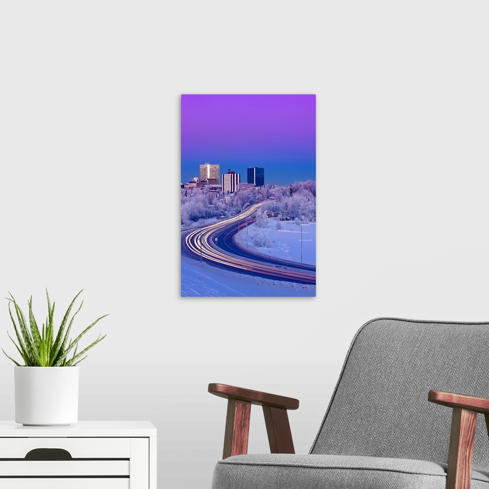 A modern room featuring Alpenglow Over The Anchorage Skyline With The Lights From Traffic On Minnesota Blvd. In The Foreg...