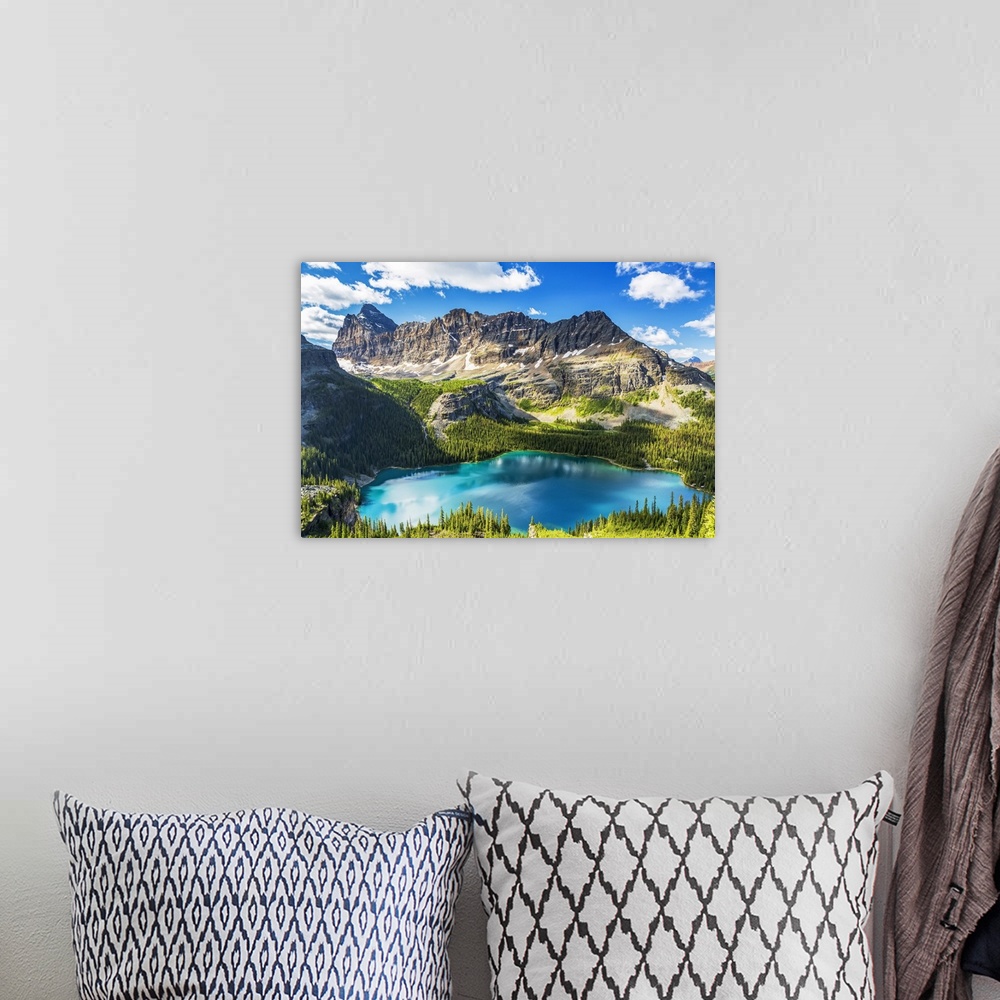 A bohemian room featuring Beautiful blue alpine lake with rugged mountain in the distance with blue sky and clouds, Yoho Na...