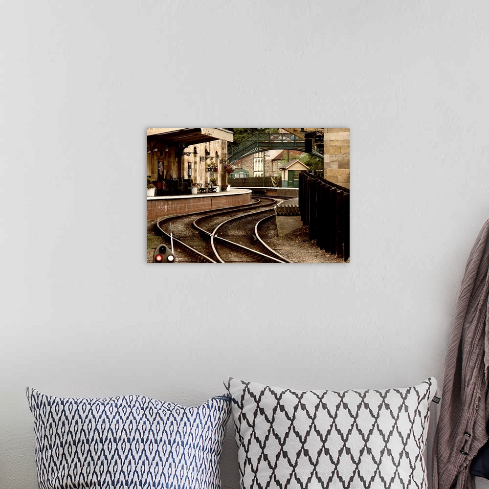 A bohemian room featuring An Old-Fashioned Train Station And Tracks.