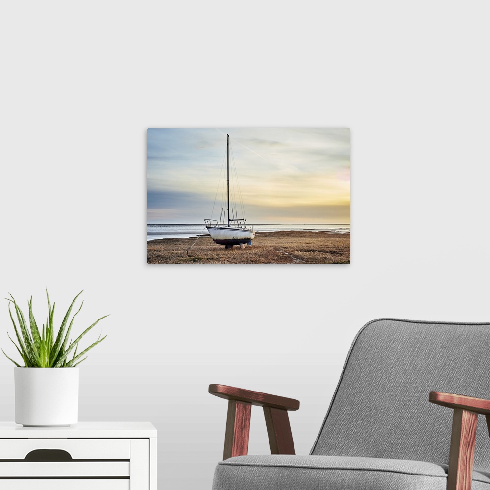 A modern room featuring An old sailing yacht on the River Ribble marshes at Lytham St Annes.
