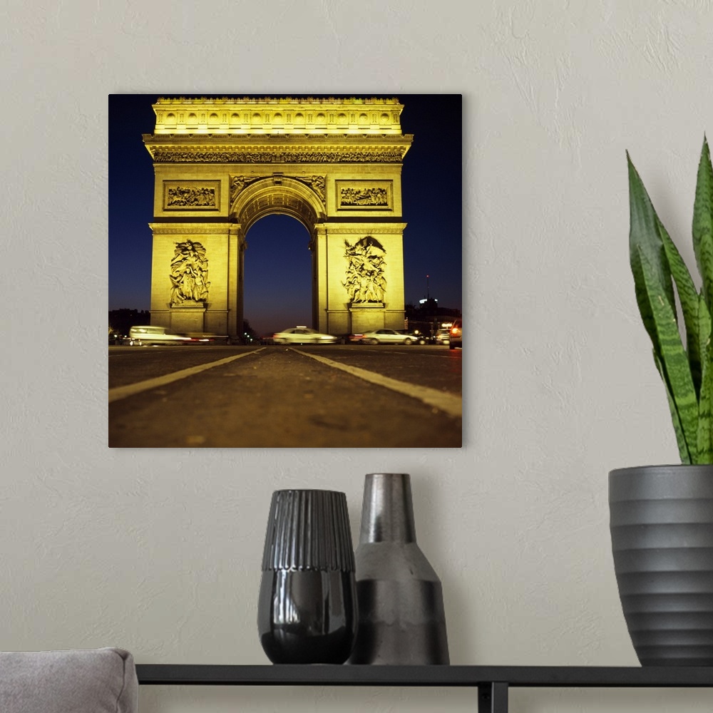 A modern room featuring Arc De Triomphe At Night