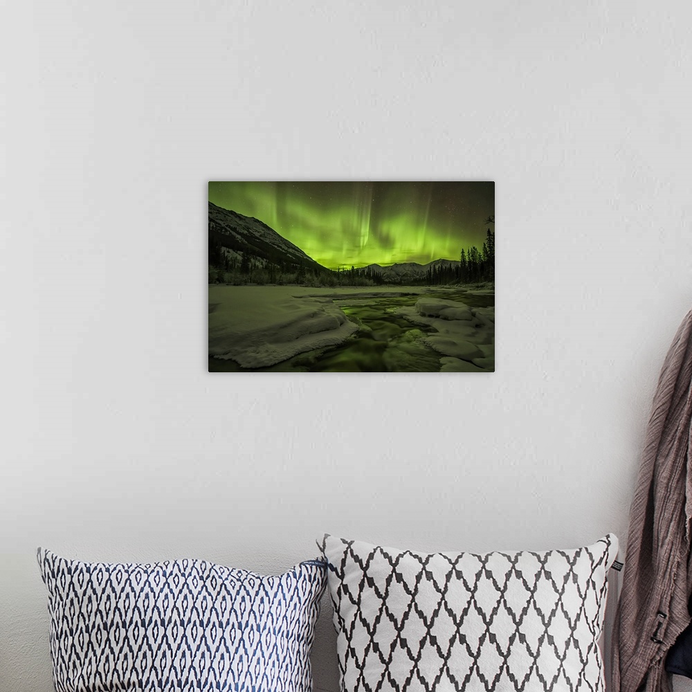 A bohemian room featuring Aurora Borealis or Northern light up the Yukon night skies; Yukon, Canada.