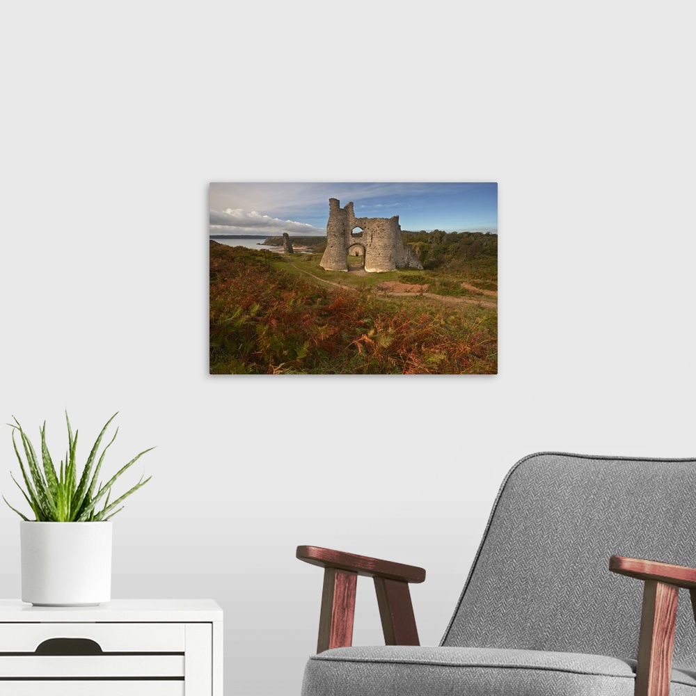 A modern room featuring Autumnal view of the ruins of Pennard Castle.