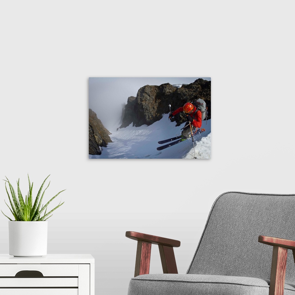 A modern room featuring Backcountry skier on West Twin Peak near Eklutna, Western Chugach Mountains, Alaska, Winter.