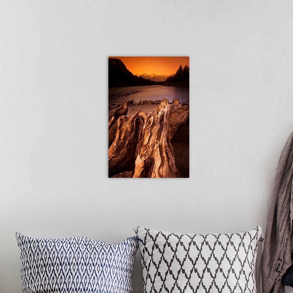 A bohemian room featuring Banff, Alberta, Canada, Driftwood And A Mountain River At Sunset