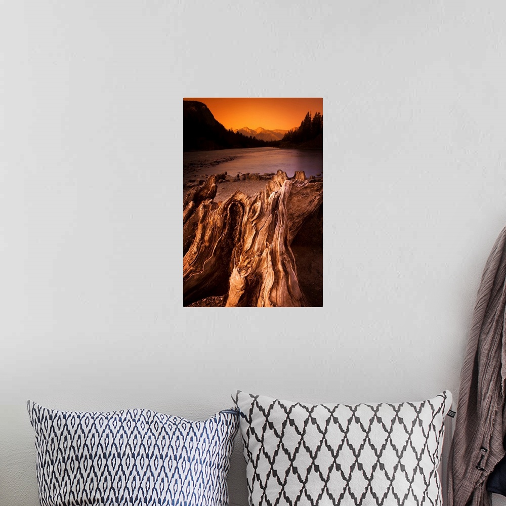 A bohemian room featuring Banff, Alberta, Canada, Driftwood And A Mountain River At Sunset