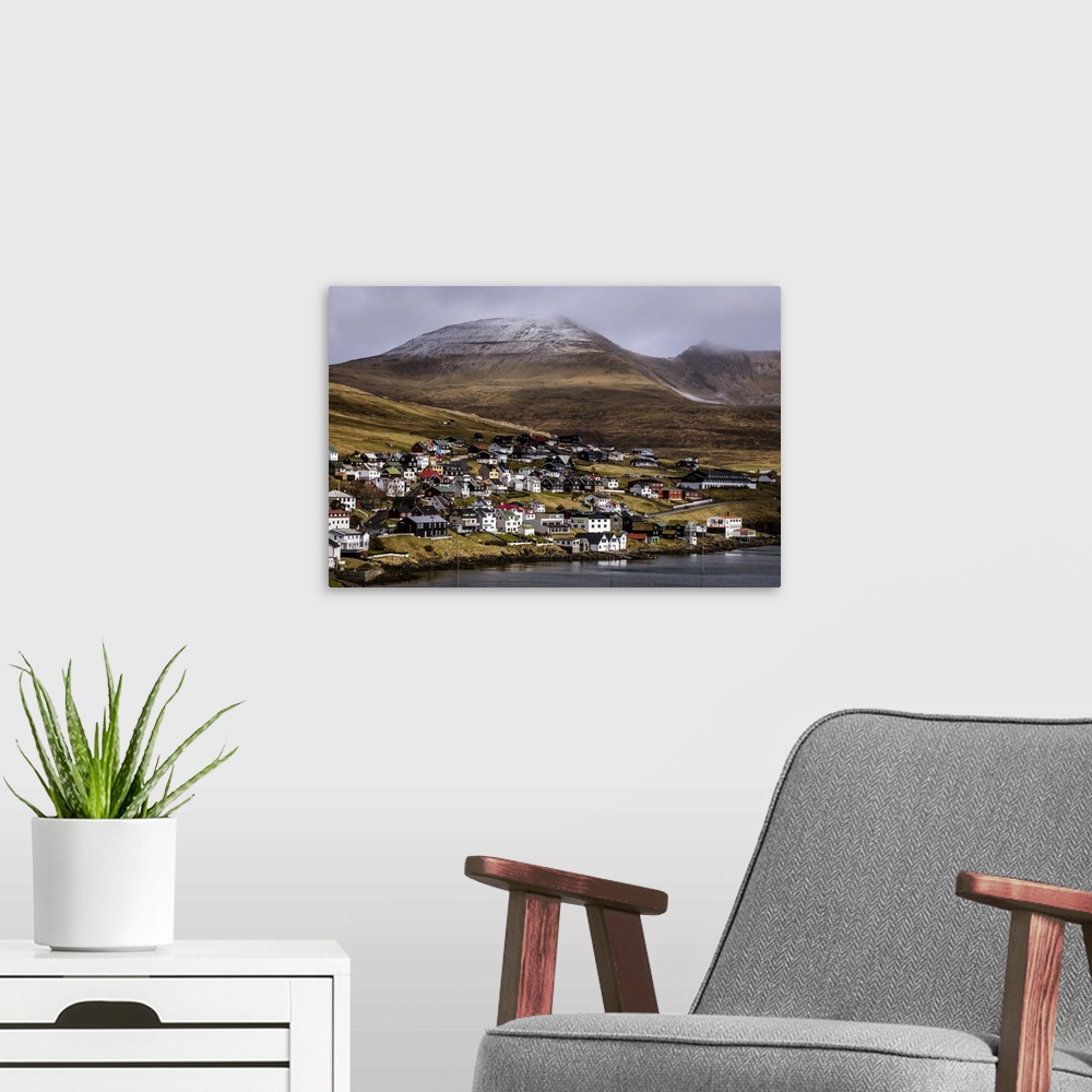 A modern room featuring Beautiful country houses of Sandavagur village in Faroe Islands.