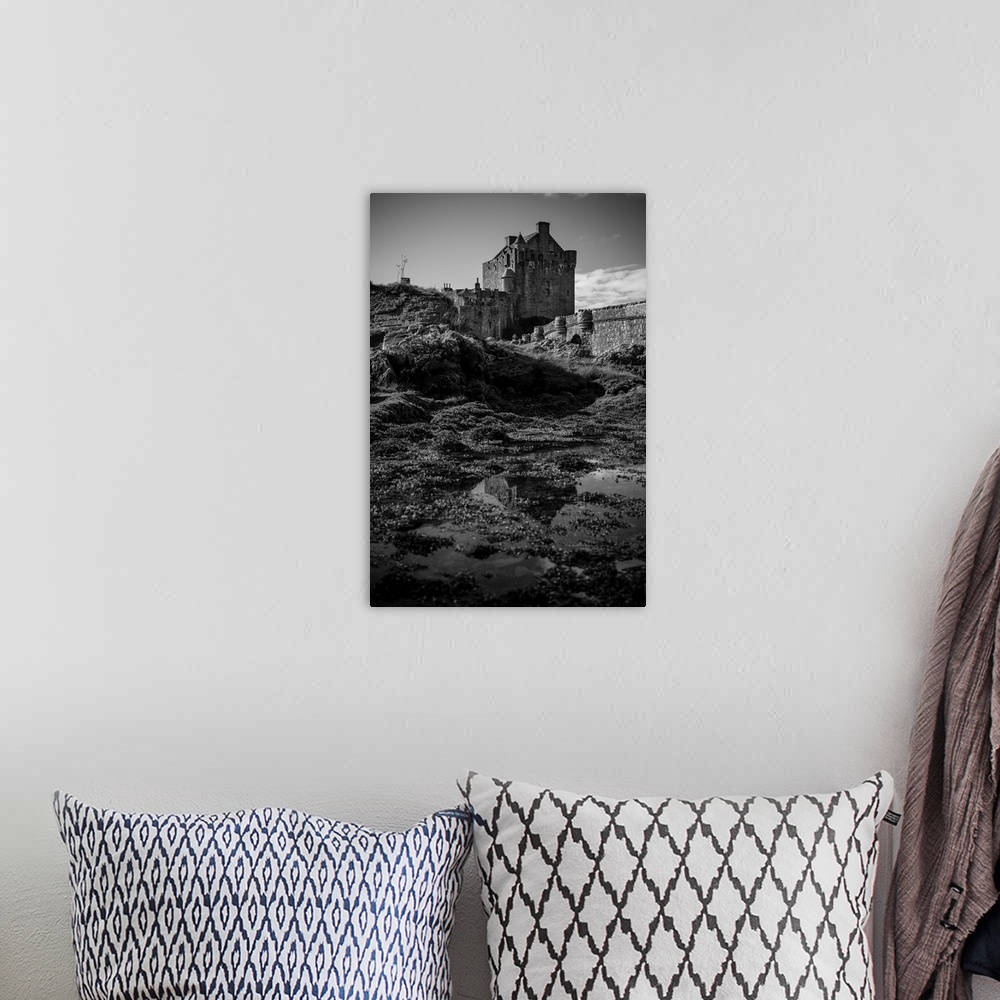 A bohemian room featuring Black and white image of a castle, isle of Skye, Scotland.