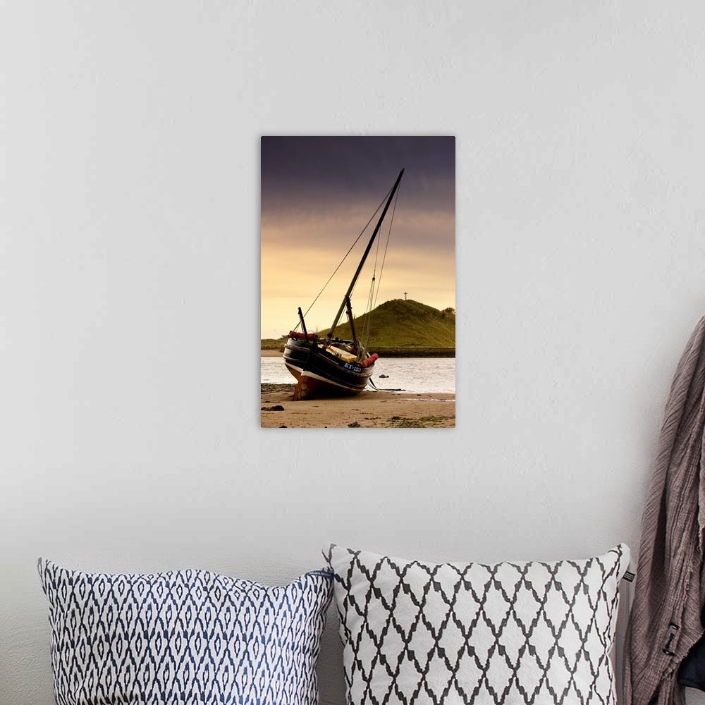 A bohemian room featuring Boat On Beach At Low Tide; Alnmouth, Northumberland, England