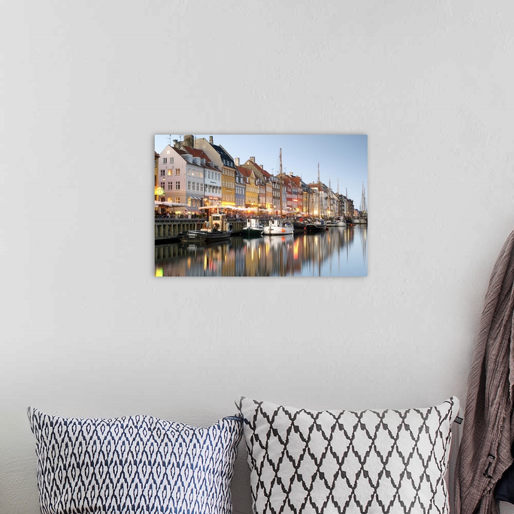 A bohemian room featuring Boats and townhouses along the Nyhavn canal in Copenhagen.