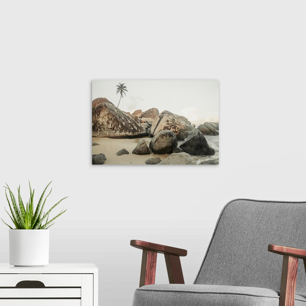 A modern room featuring Close-up view of the large, boulders on the seaside shores of The Baths, a famous beach in the BV...