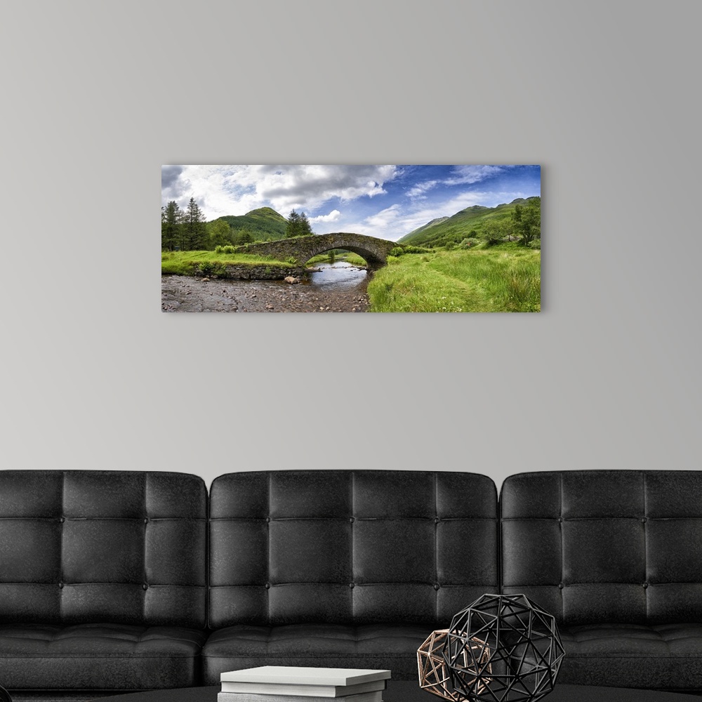 A modern room featuring Panoramic view of Butter Bridge over Kinglas Water in the Loch Lomond National Park in Scotland.