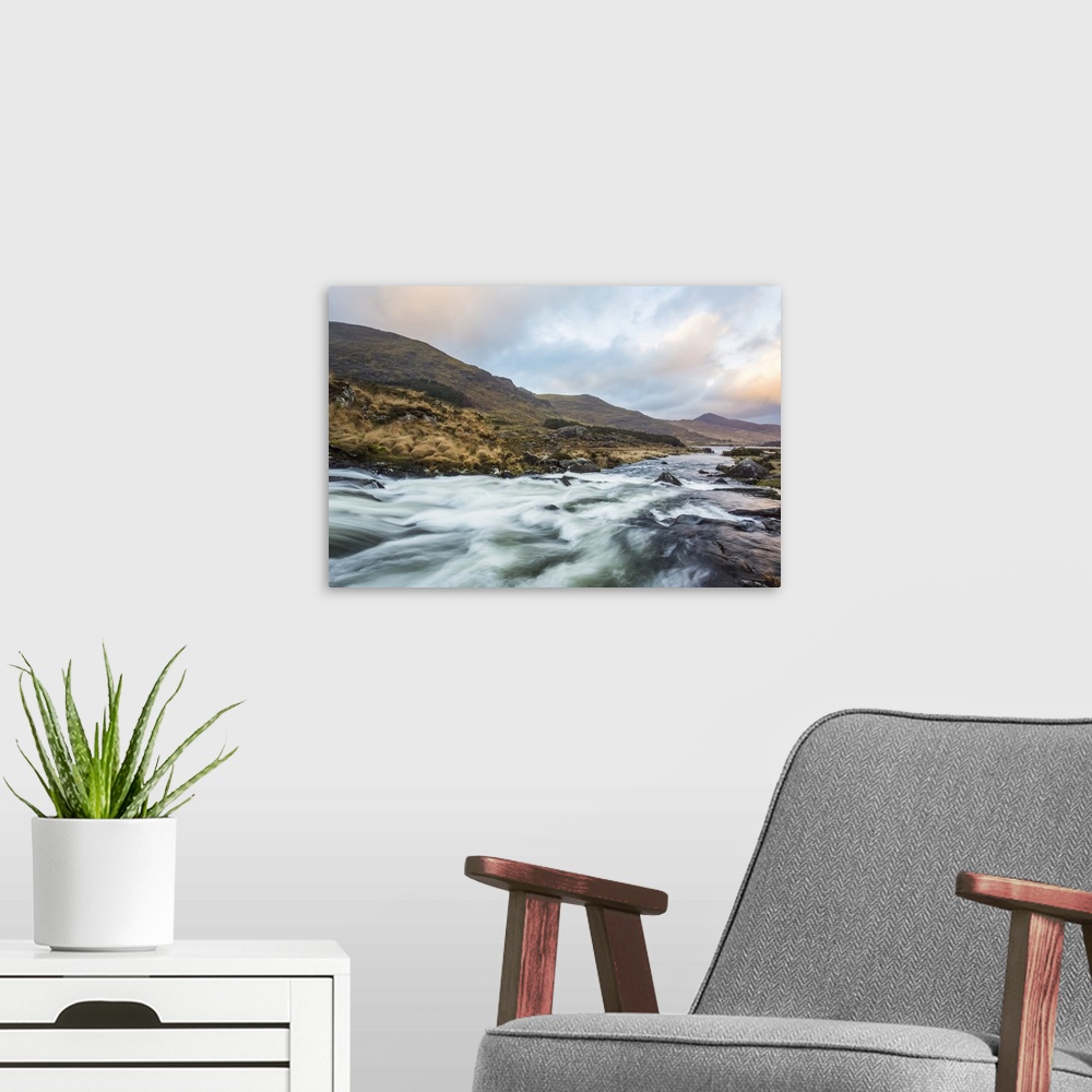 A modern room featuring Cascades on a river in the Black Valley in Kerry with the MacGillycuddy's Reeks in the background...