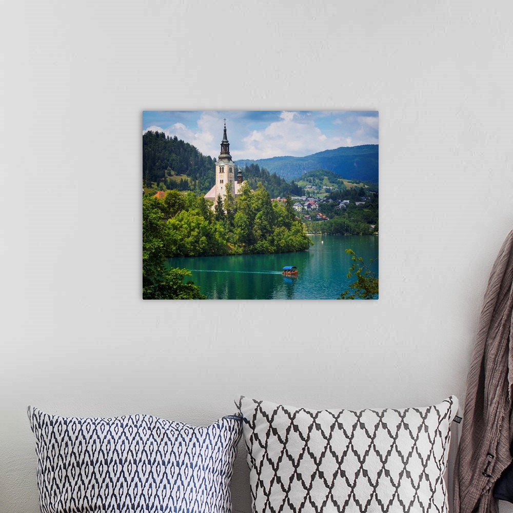 A bohemian room featuring Church of the Assumption on Bled Island. Bled, Upper Carniola, Slovenia.