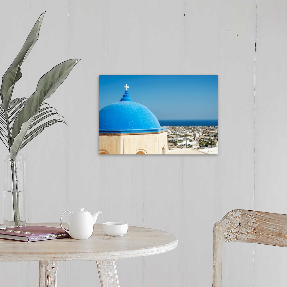 A farmhouse room featuring Church with a blue dome roof and view of the Aegean sea, Megalochori, Santorini, Greece