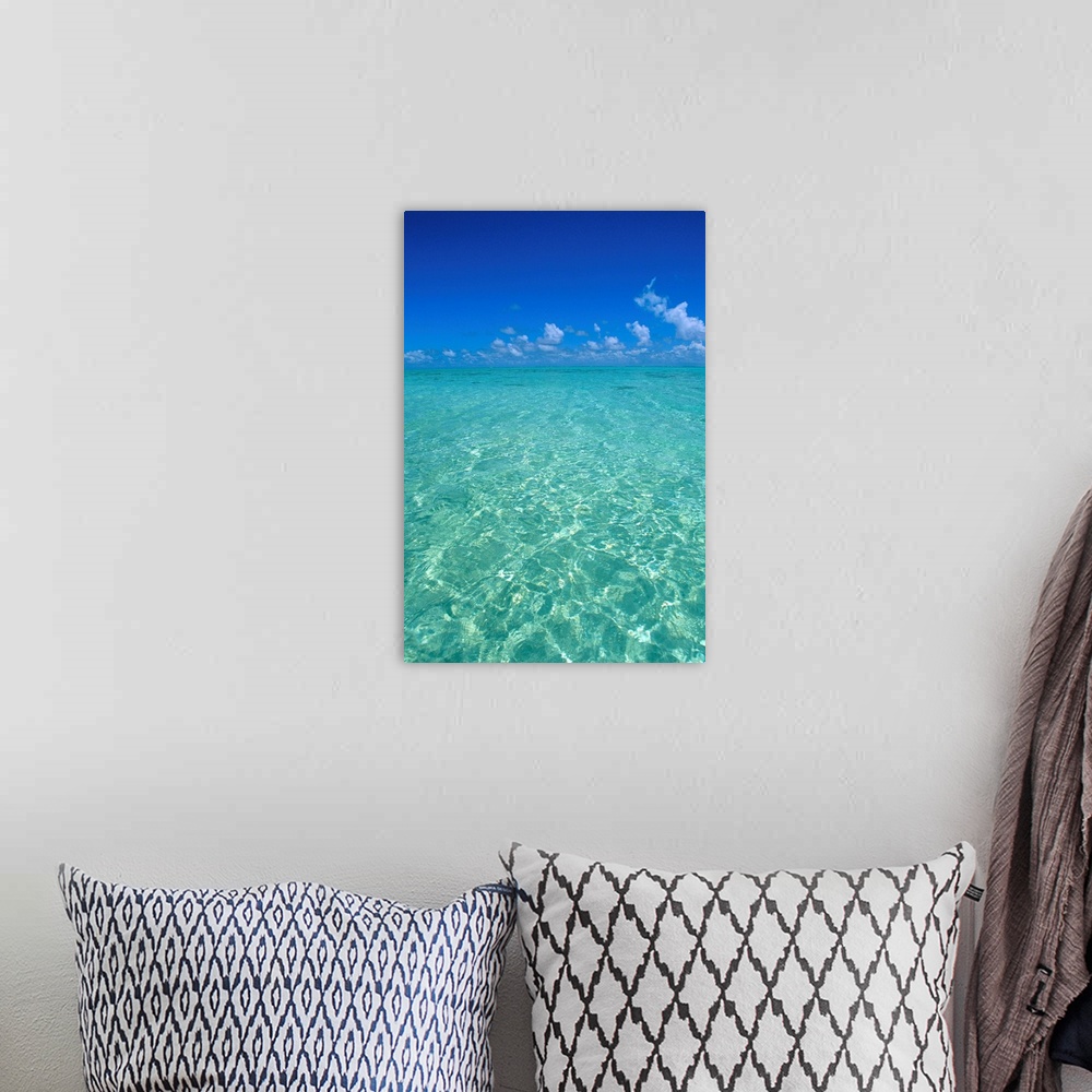 A bohemian room featuring Clear Turquoise Ocean Water, Blue Sky, White Clouds