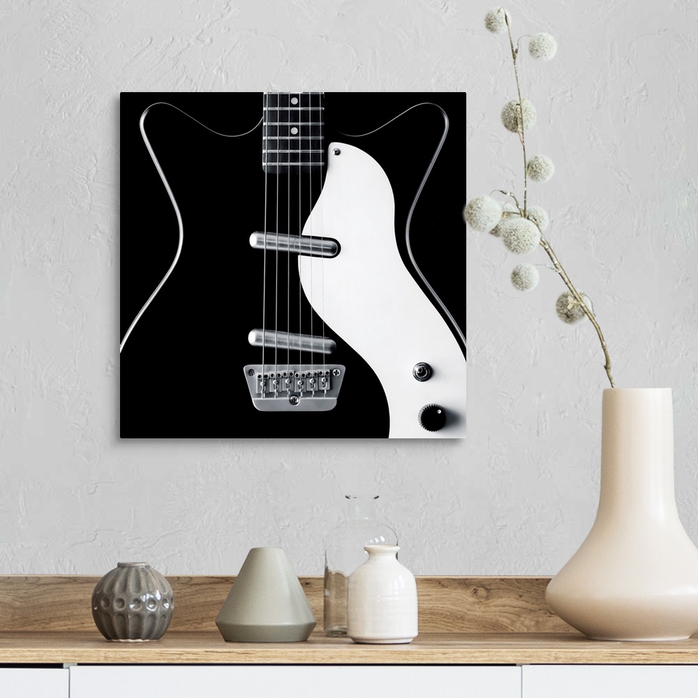 A farmhouse room featuring Close-up of a black and white electric guitar.