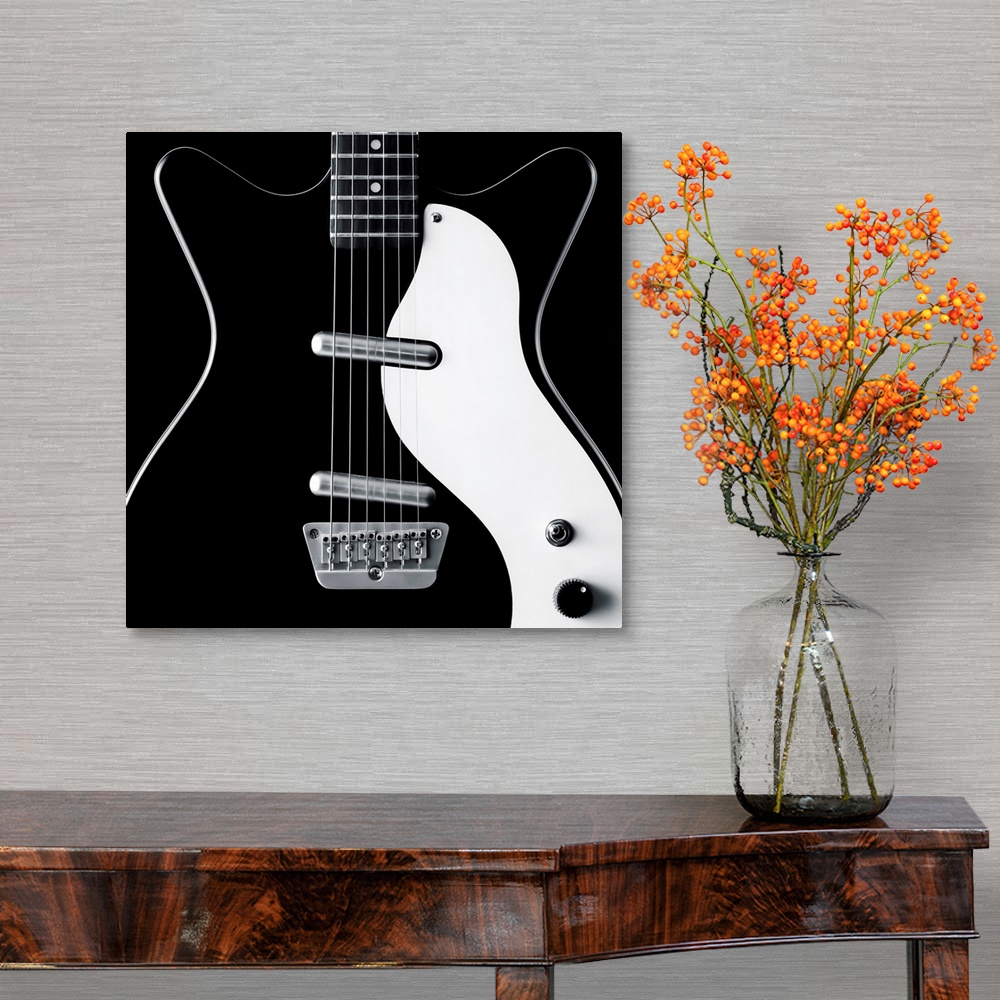 A traditional room featuring Close-up of a black and white electric guitar.