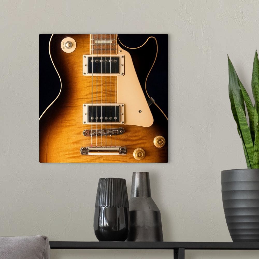 A modern room featuring Close-up of a single cut electric guitar.