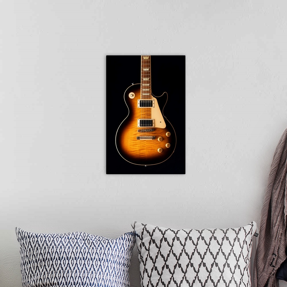 A bohemian room featuring Close-up of an electric guitar.