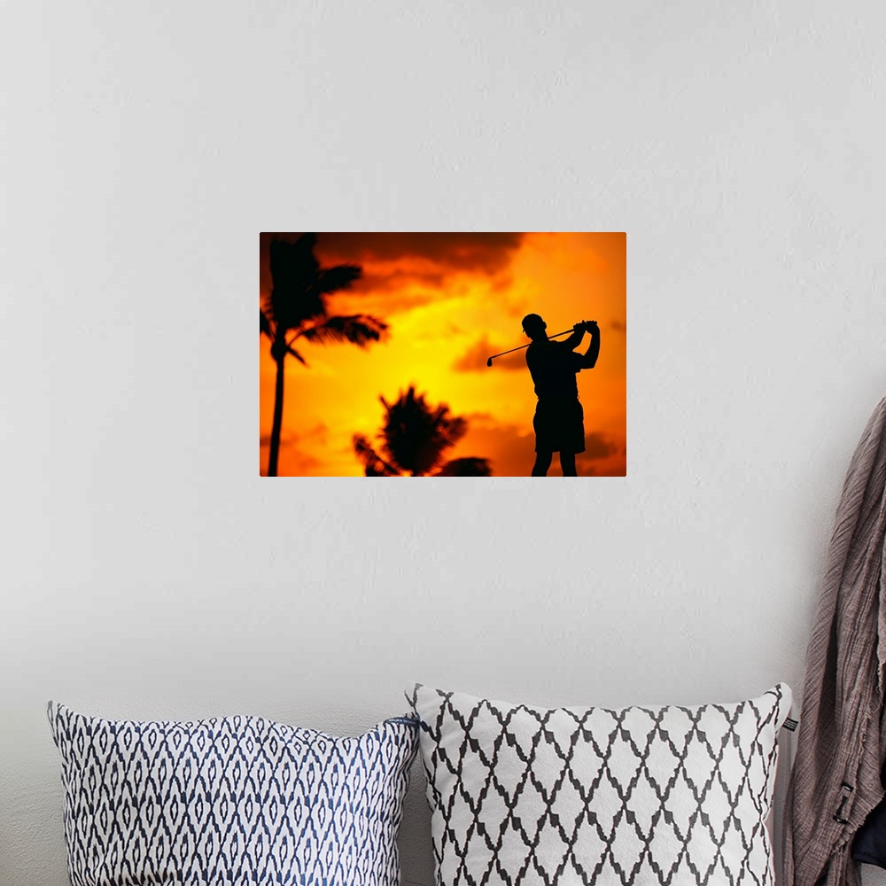 A bohemian room featuring Close-Up Of Man Swinging, Silhouetted In Orange Skies, Palms Hazy In Background