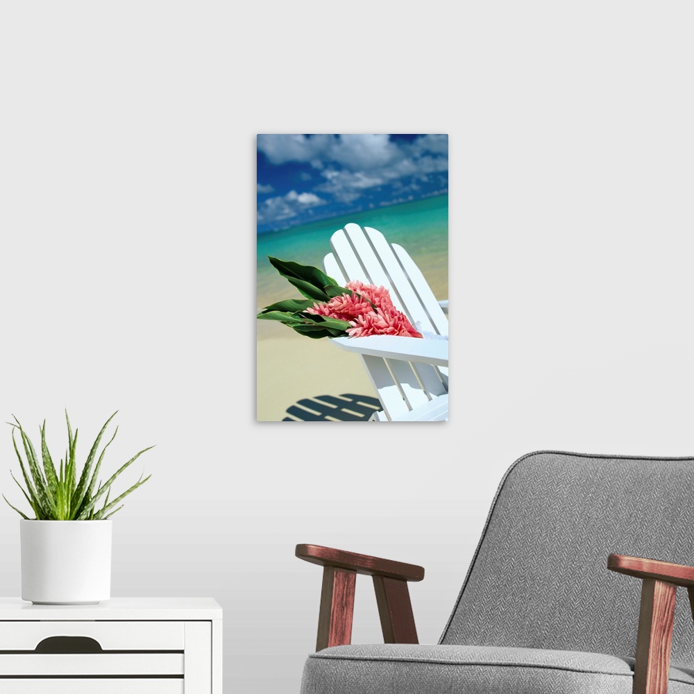 A modern room featuring Close-Up Of White Beach Chair With Bunch Of Pink Ginger, On White Sand