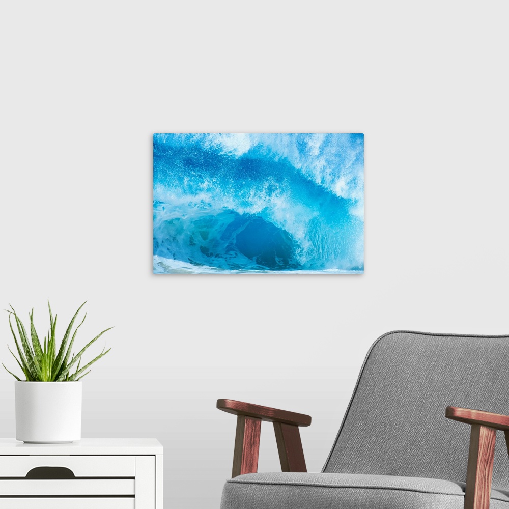 A modern room featuring Up-close photograph of huge swell crashing down into ocean.