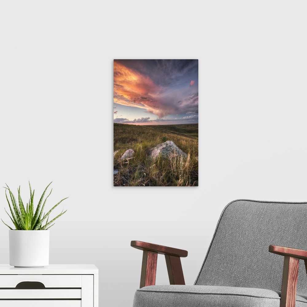 A modern room featuring Clouds Lit At Sunset With Some Glacial Erratics Lying In Grasslands National Park;Saskatchewan Ca...