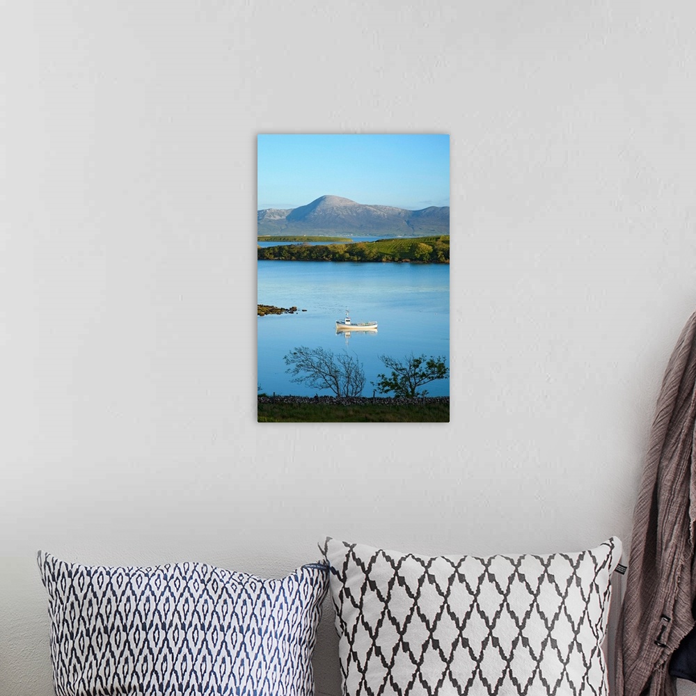 A bohemian room featuring Co Mayo, Ireland; Fishing Boat In Clew Bay Beneath Croagh Patrick