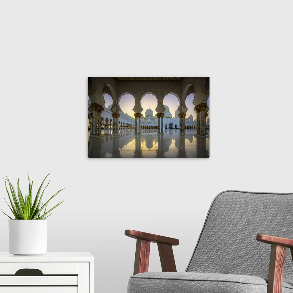 A modern room featuring Columns and arches of the Grand Mosques at sunset.