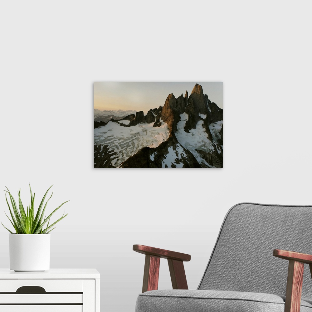 A modern room featuring Devils Thumb stands distinctively higher than other granite peaks in Stikine Icefield. Cloaked wi...