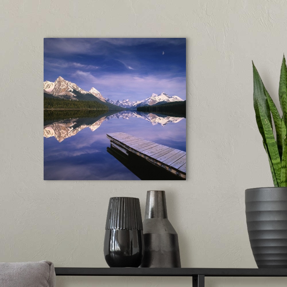 A modern room featuring Dock In Lake, Mountains In Background; Alberta, Canada