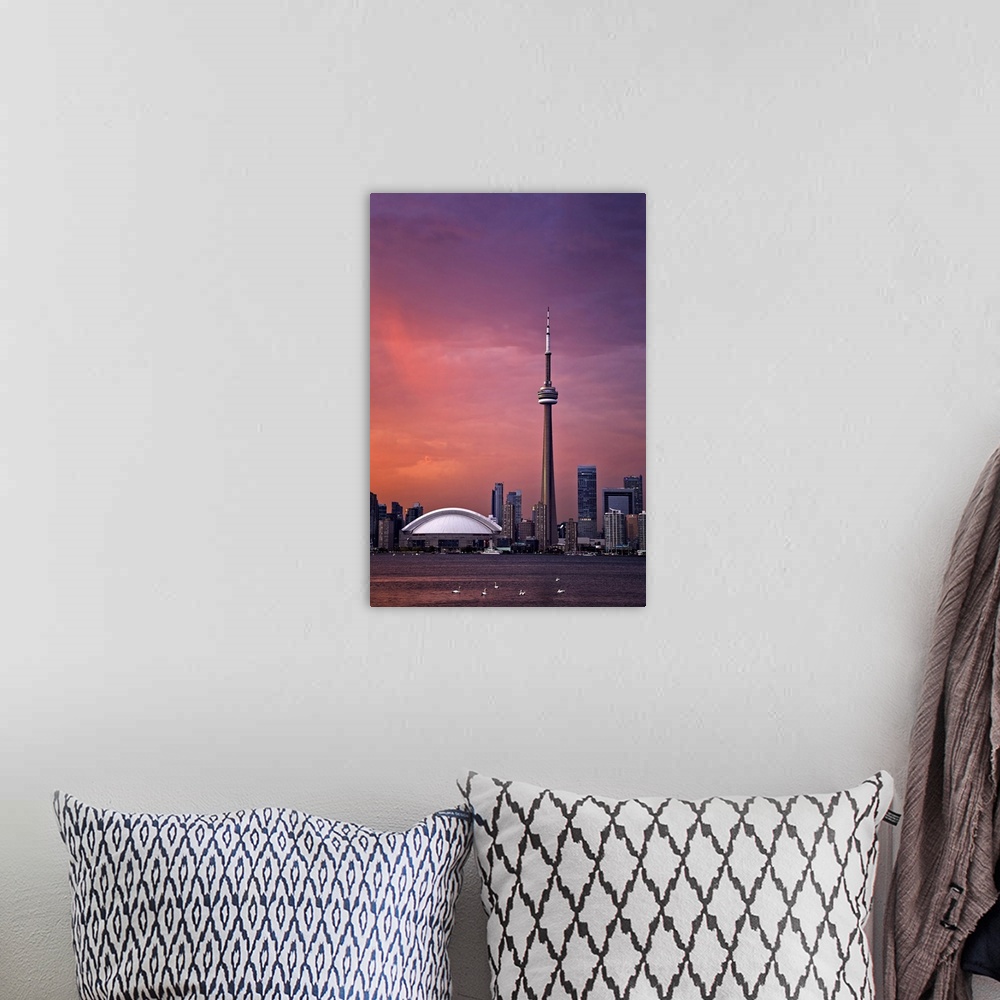 A bohemian room featuring Downtown Toronto across Lake Ontario at sunset.