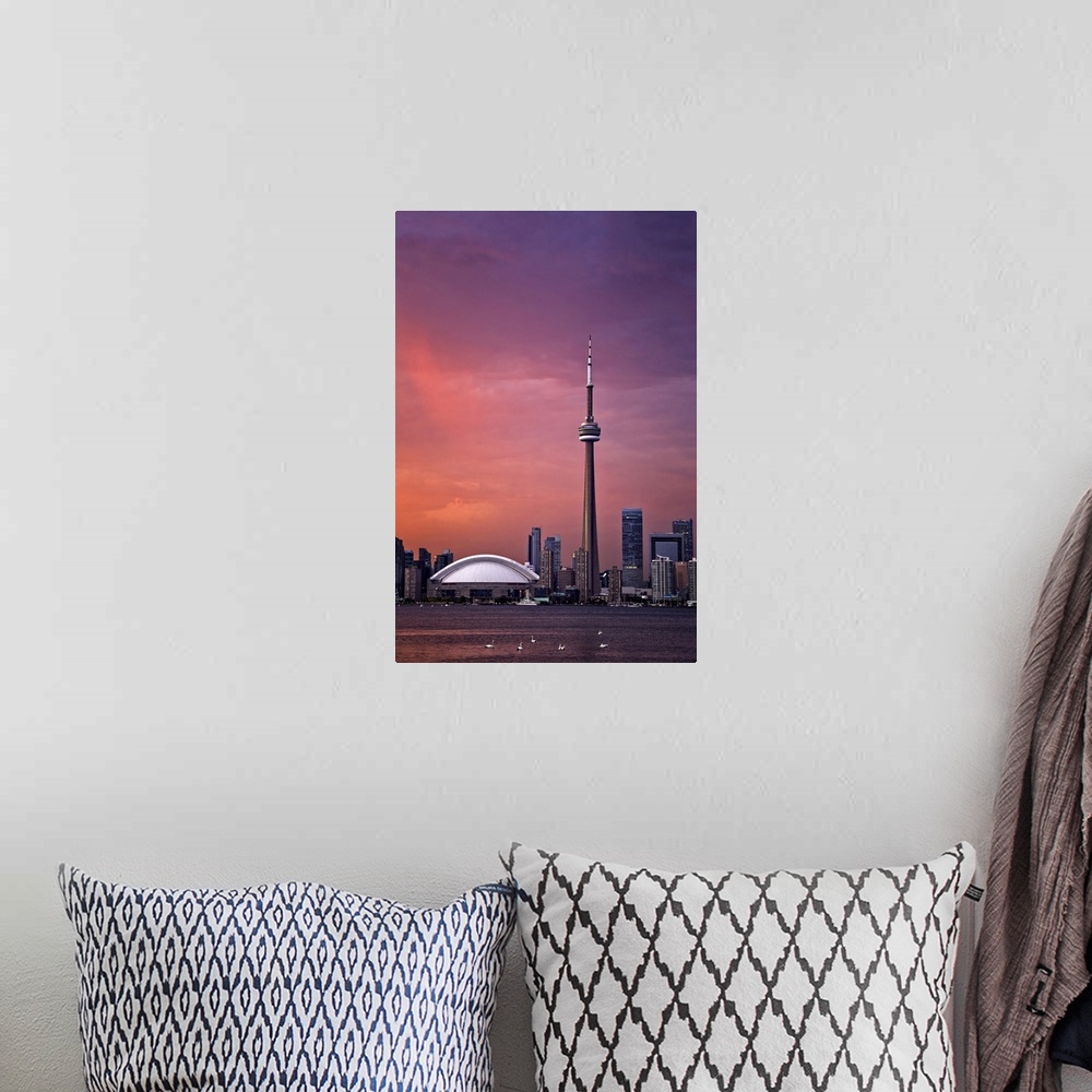 A bohemian room featuring Downtown Toronto across Lake Ontario at sunset.