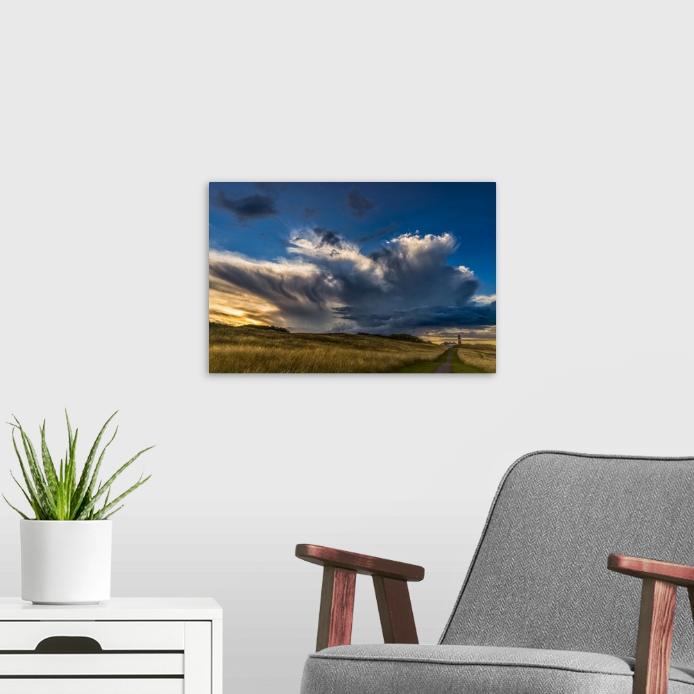 A modern room featuring Dramatic cloud formation over Souter Lighthouse at sunset; South Shields, Tyne and Wear, England.