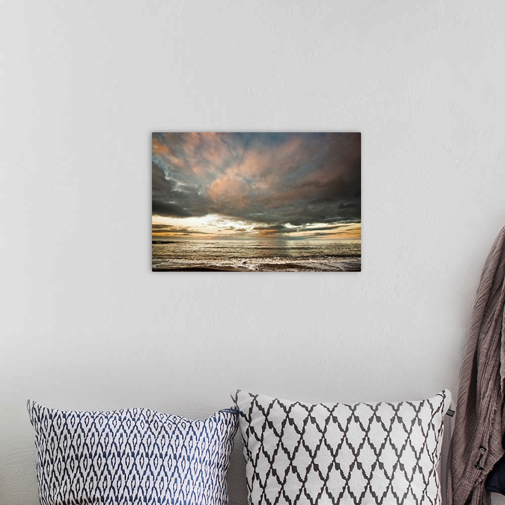 A bohemian room featuring Dramatic clouds at sunset over the water. South Shields, Tyne and Wear, England.