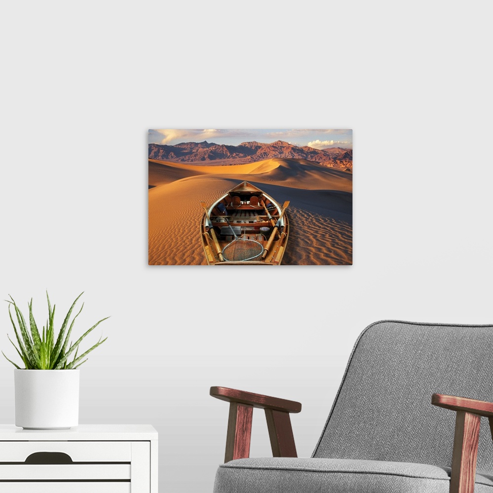 A modern room featuring Drift boat and Death Valley National Park sand dunes. Composite.