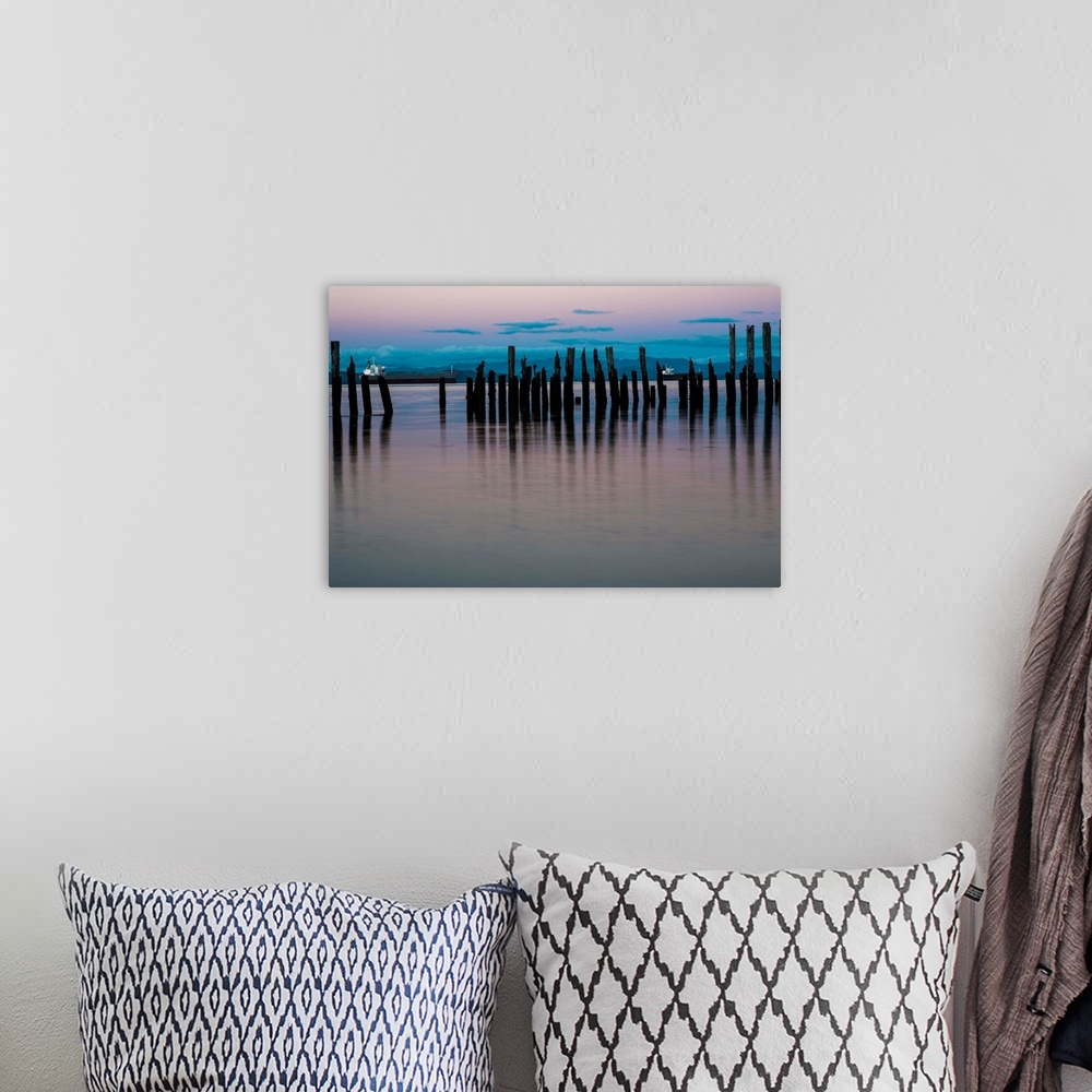 A bohemian room featuring Dusk settles over the Columbia River; Astoria, Oregon, United States of America