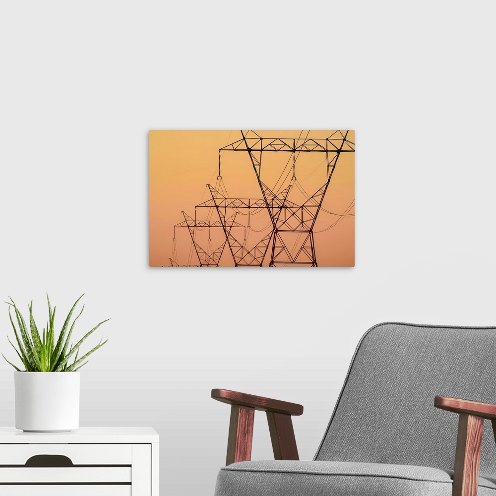 A modern room featuring Electrical transmission towers at sunset, Ohio