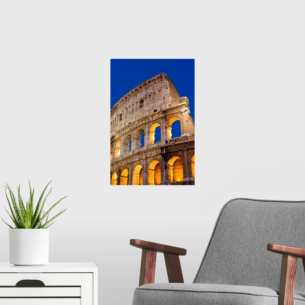 A modern room featuring Exterior View Of The Coliseum Amphitheatre At Night, Rome, Italy