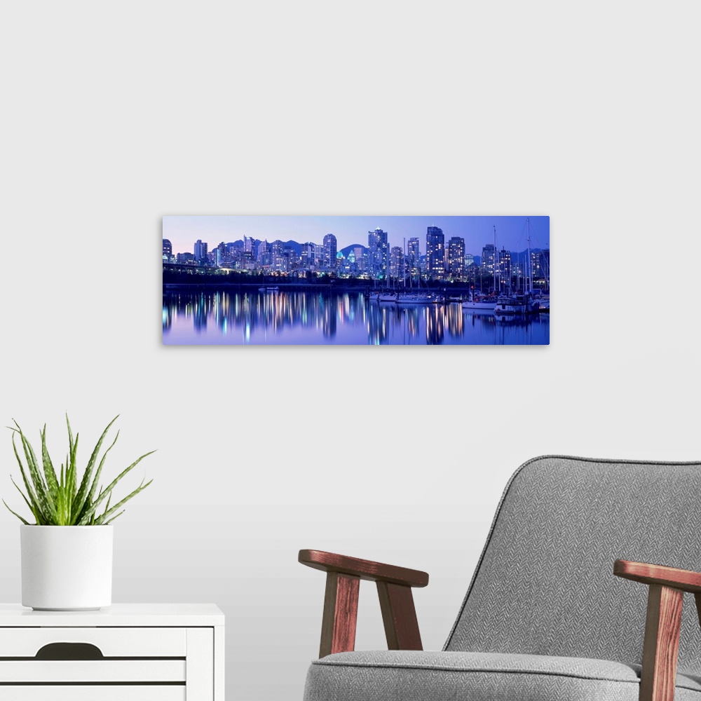A modern room featuring False Creek Skyline, Twilight, Vancouver, British Columbia, Canada