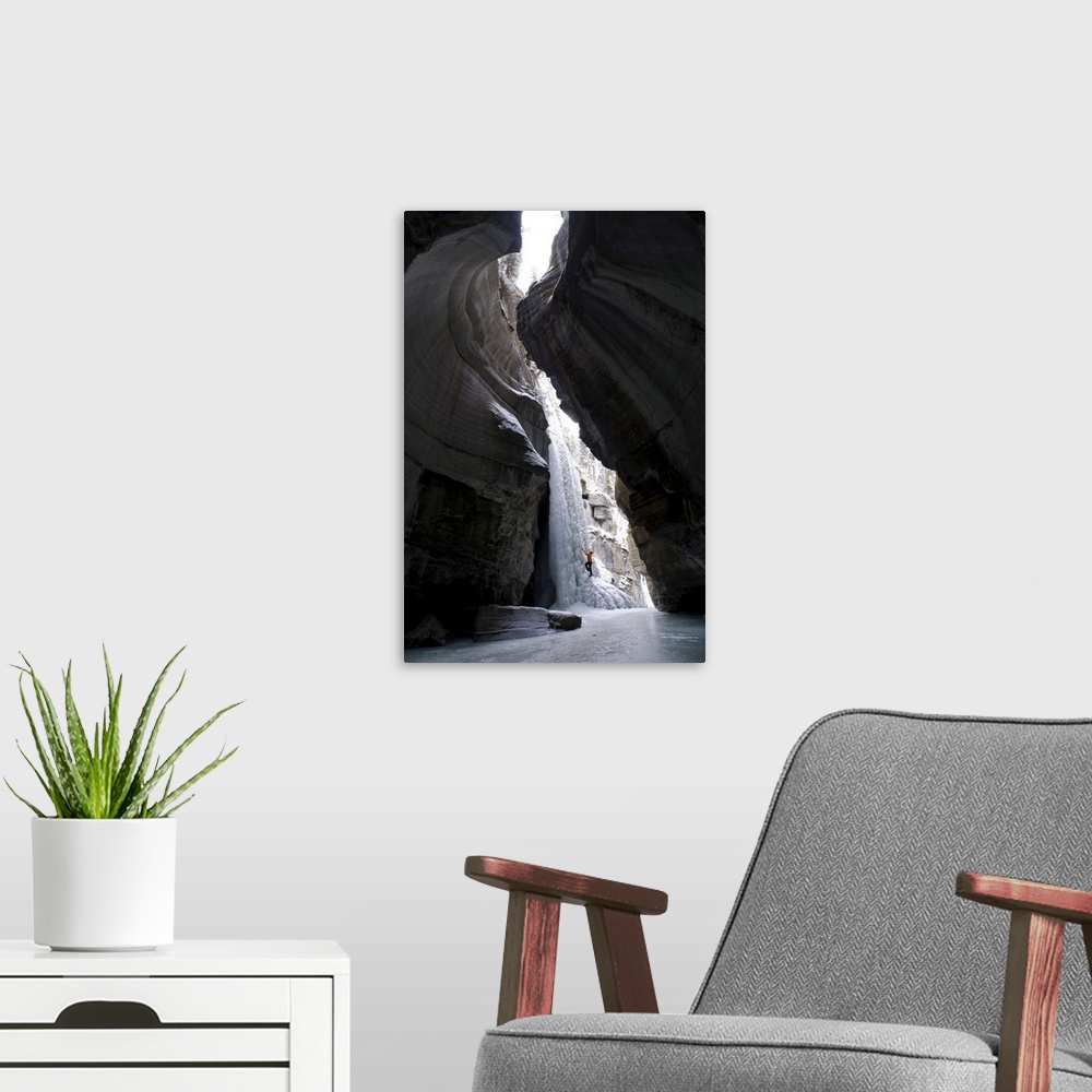 A modern room featuring Female Climber Explores Ice Climbing In The Narrows Of Maligne Canyon In Jasper National Park, Al...