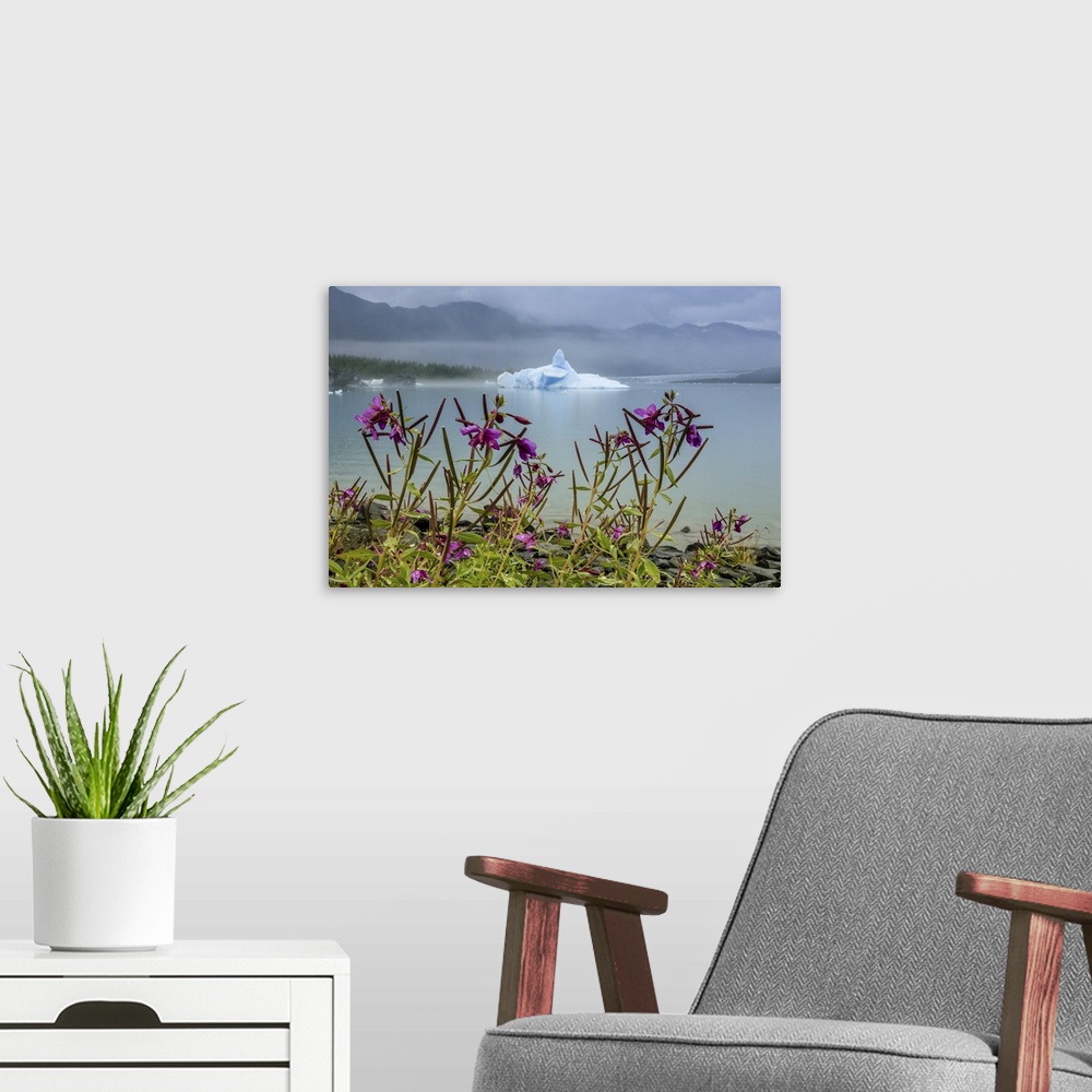 A modern room featuring Fireweed (Chamaenerion angustifolium) and sculpted blue iceberg in Bear Glacier Lagoon, Kenai Fjo...