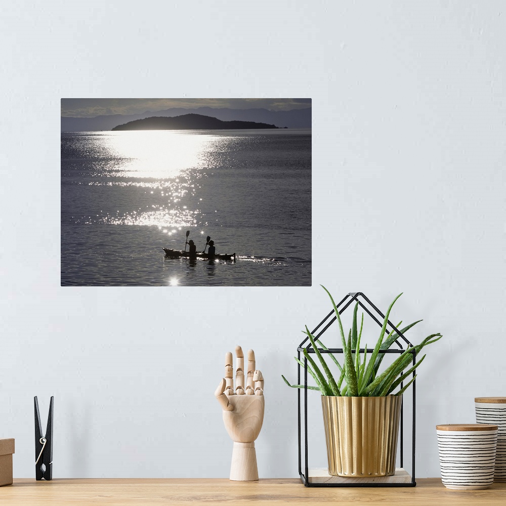 A bohemian room featuring Fishermen Going Past The Island Of Domwe At Dusk; Malawi, Africa