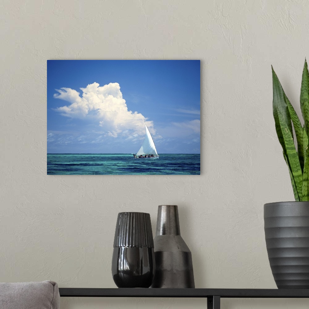 A modern room featuring Fishermen In Dhow Sailing In Shallow Water In Front Of Large Thunder Storm Cloud